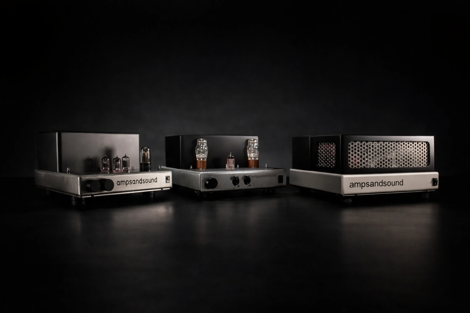 Ampsandsound debuts three new tube components at AXPONA 2026, including the Kenzie Reimagined headphone amp, Badlands preamplifier, and Stereo 17 power amplifier, showcasing refined craftsmanship and classic tube sound.